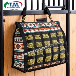 Black webbing hay feeder bag with colourful Southwestern patterned fabric in stable | T.M. Exports India