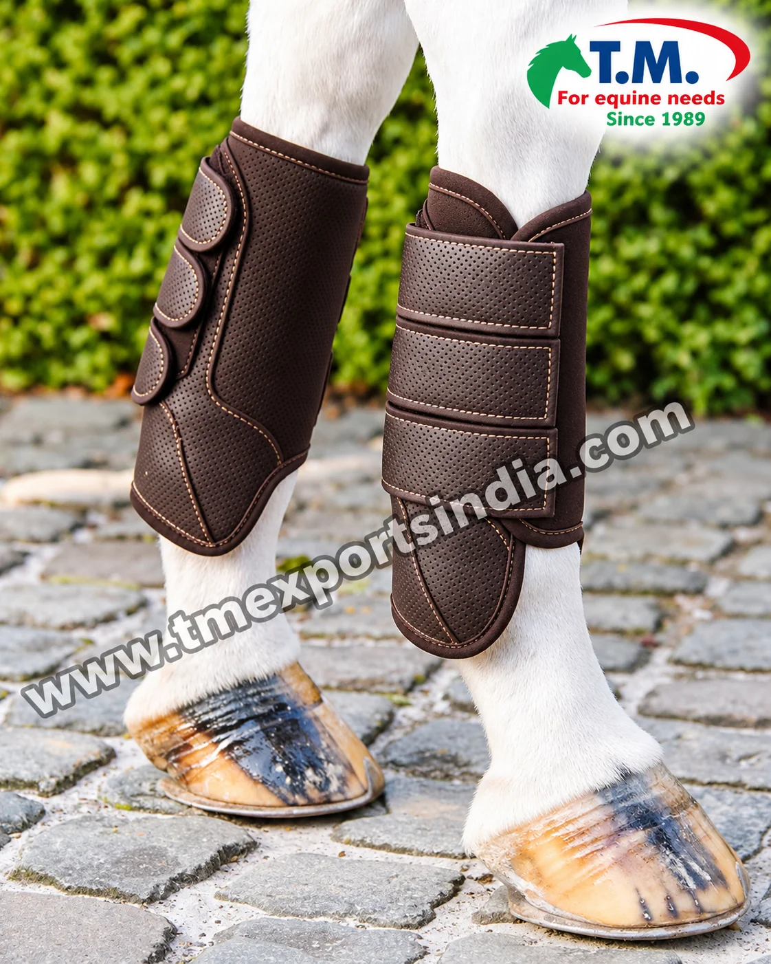 Brown Perforated Horse Brushing Boots with Triple Straps in brown, perforated-look outer panels, contrasting stitching and three adjustable fastening straps – T.M. Exports India wholesale equestrian catalogue