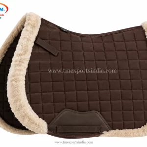Brown quilted saddle pad with square stitching, cream plush edge trim, and girth strap.