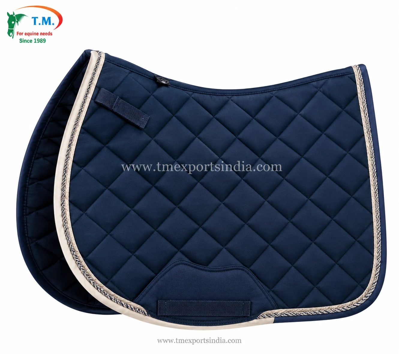 Navy blue quilted saddle pad with diamond stitching, cream binding, decorative cord, and reinforced girth area.