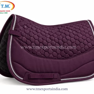 Deep plum saddle pad with hexagonal quilting, curved lower panel, and silver-colored piping.