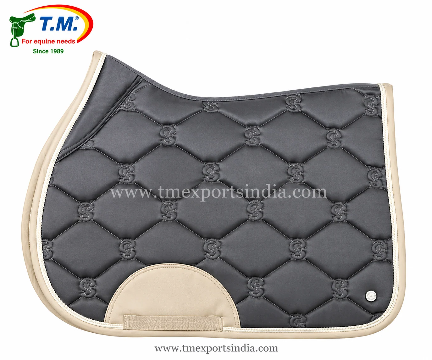 Charcoal grey saddle pad with diamond quilting, stitched decorative motifs, cream binding, and girth patch.