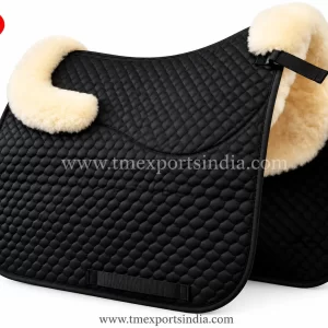 Black saddle pad with fine diamond quilting, cream plush front and rear trim, and girth patch.