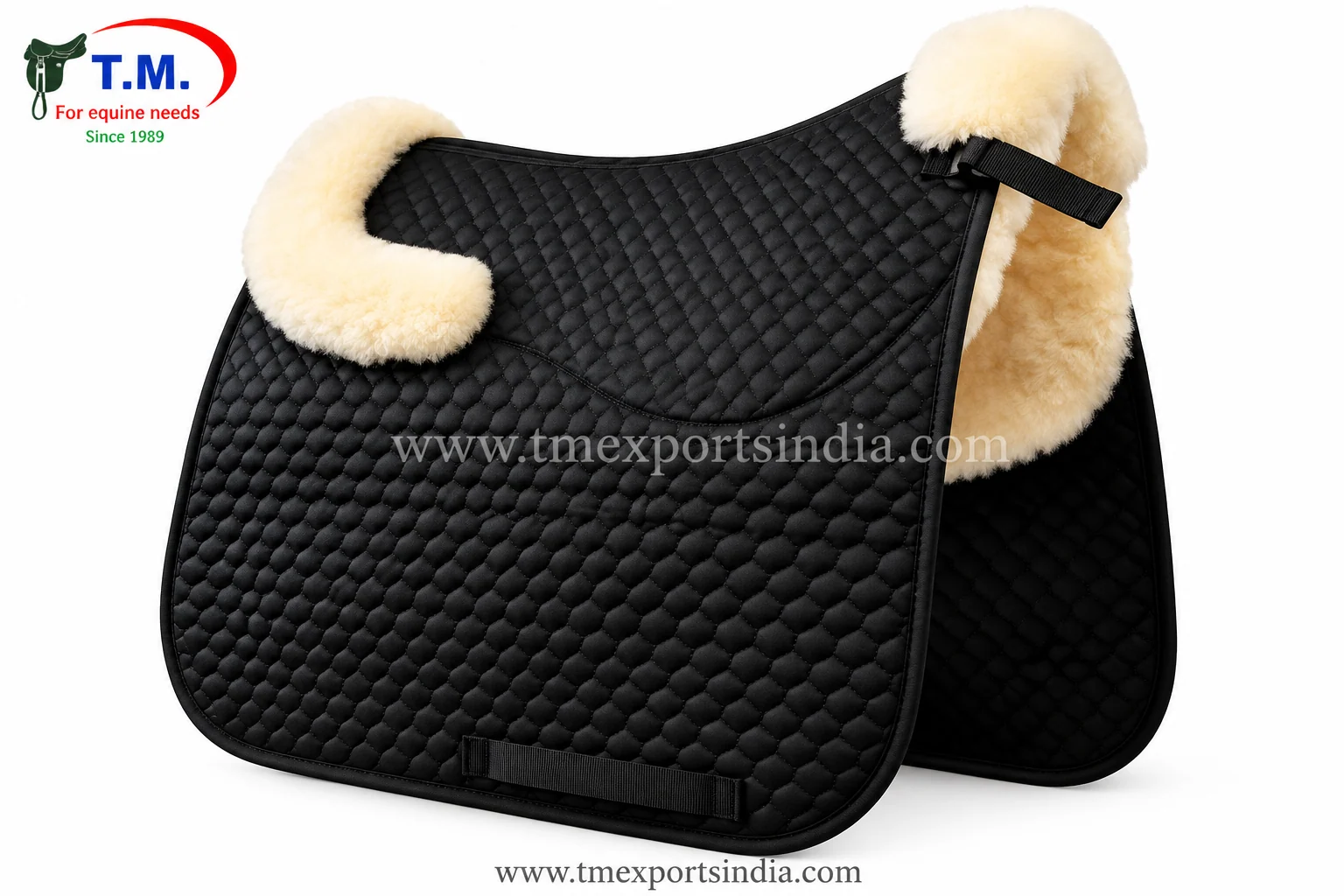 Black saddle pad with fine diamond quilting, cream plush front and rear trim, and girth patch.