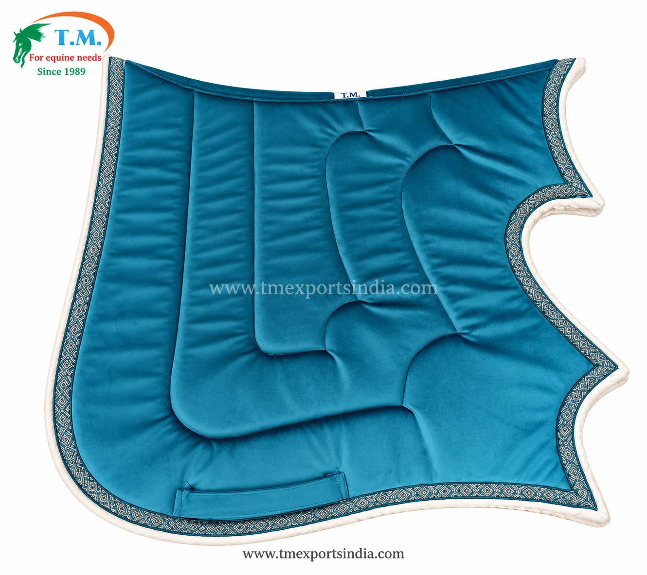 Bright teal shaped saddle pad with sculpted central panel, white piping, and patterned decorative edge trim.